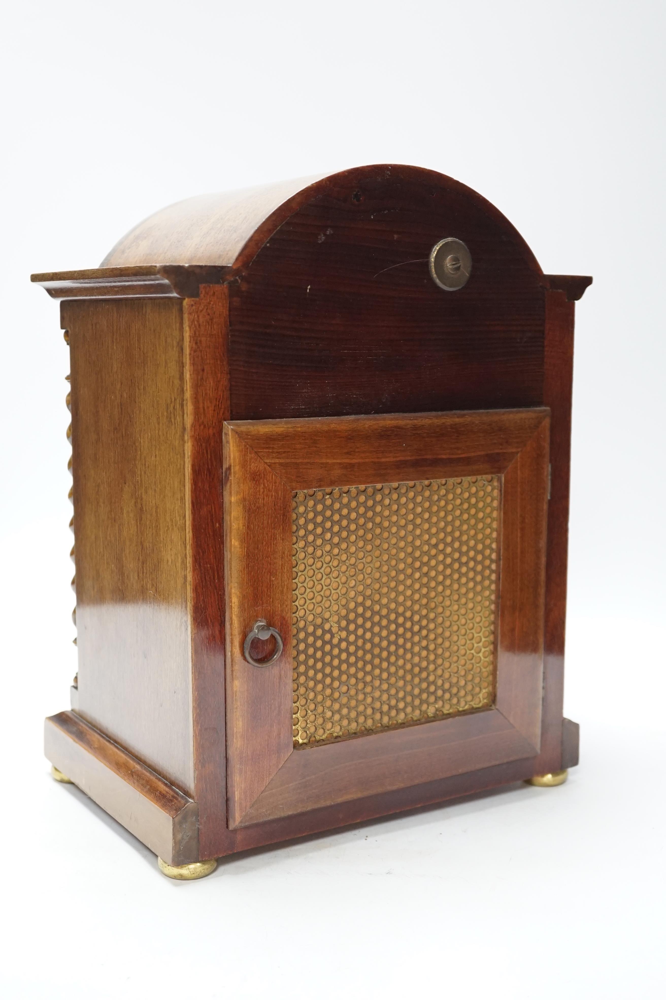 An early 20th century mahogany chiming bracket clock with silvered Roman numeral dial, 34cm high